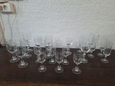 a lot of wine glasses sitting on a table