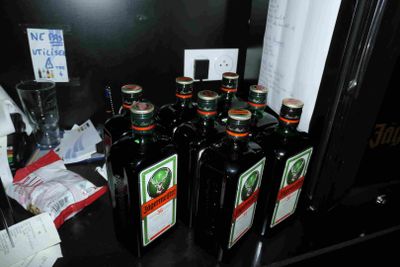 several bottles of beer are lined up on a counter