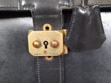 a close up of a black bag with a lock on it