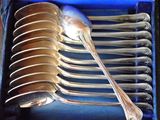 silver spoons in a blue box with a blue lid