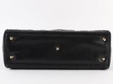 a black leather wallet with rivets and rivets on the front