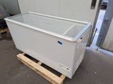 a large freezer sitting on a pallet in a warehouse