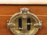 a close up of a drawer with a clock on it
