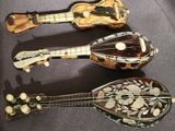three different types of musical instruments are displayed on a table