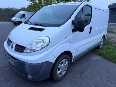 a white van that is parked on the side of the road