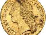 gros plan d'une pièce d'or portant un visage de femme