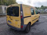 a yellow van that is parked in a parking lot
