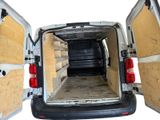 the back of a van with its doors open showing the inside of it