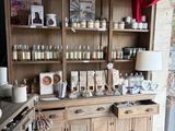 a large wooden cabinet with a lot of jars on it