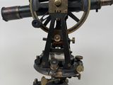 an old brass and black telescope on a tripod stand