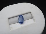 a close up of a blue sapphire stone in a white ring
