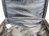 a silver suitcase that is open on a white surface