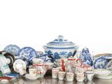 a table with a lot of blue and white china on it