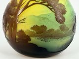 a vase with a picture of a tree on it