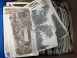 a box full of old photos of a house