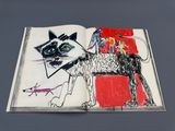 a book with a drawing of a cat and a dog on it