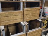 several wooden drawers are stacked on top of each other in a room