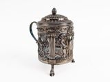 an antique silver teapot with a lid on a white background