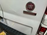 a white truck with a fiat logo on the back of it