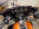 a close up of a motorcycle ' s dashboard with a mirror