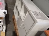 a white refrigerator and a white stove in a room