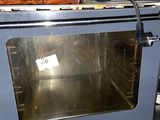 a silver oven with a blue door and a black handle