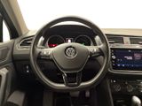 the interior of a car with a steering wheel and dashboard controls