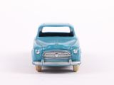 a blue toy car that is sitting on a white surface