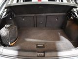 a trunk of a car with luggage in the trunk