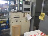 a machine that is sitting in a room with a lot of boxes
