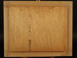 an image of a wooden easel with a painting on it