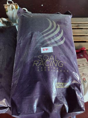 two bags of food that are sitting on a pallet