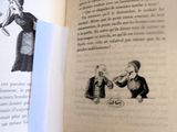 un livre ouvert sur lequel est dessiné un homme et une femme