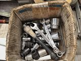 a basket full of tools sitting on top of a table