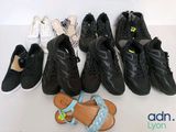 several pairs of shoes are lined up on a white surface
