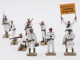 several figurines of men in white uniforms holding signs