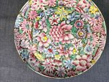 several plates and bowls are sitting on a table with a blue table cloth