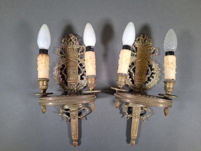 pair of antique wall sconces with brass finish and frosted glass