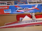 a box with a toy airplane in it on a table