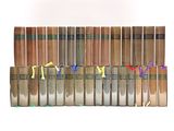 a lot of books that are stacked on top of each other