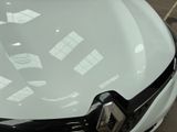 a close up of a car ' s hood with a lot of stickers on it