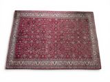 a red rug on a white surface with a white background