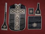 a black and white cross on a black and white cloth