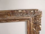 a picture of a gold frame with a picture on it