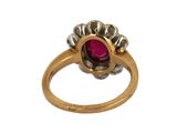 an image of a close up of a ring with a ruby stone