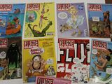 a lot of comic books that are on the table