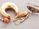 two pairs of gold and coral earrings and a pair of earrings