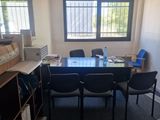 a room with a table and chairs in it