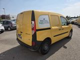 a yellow van that is parked in a parking lot