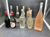 bottles of alcohol are lined up in a row on a counter